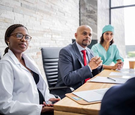 Hospital manager in meeting with doctors