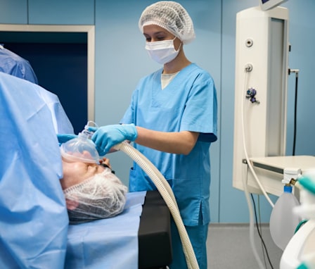 Nurse anesthetist helping patient in surgery