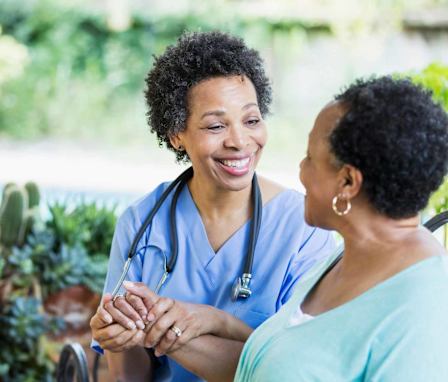 Nurse helping patient at home