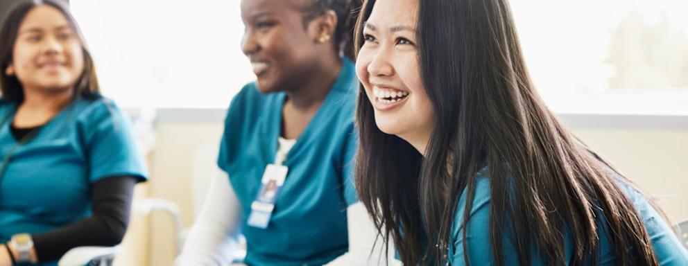 Nurses laughing and talking together