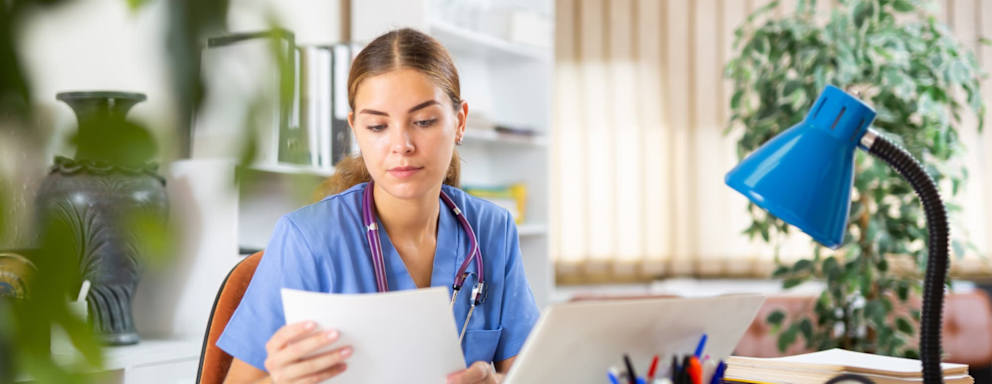 Nursing student searching for scholarships on a laptop