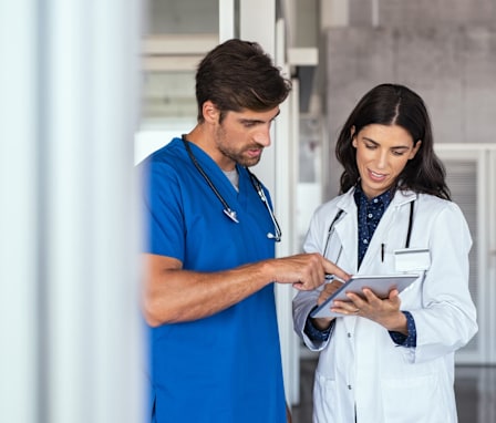 Doctor and nurse discussing medical report